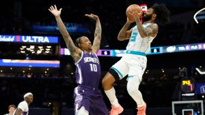 Charlotte Hornets guard Coby White (3) looks to shoot against Sacramento Kings guard DeMar DeRozan (3) during the first half of an NBA basketball game in Charlotte, N.C., Tuesday, March 24, 2026. (Nell Redmond/AP)