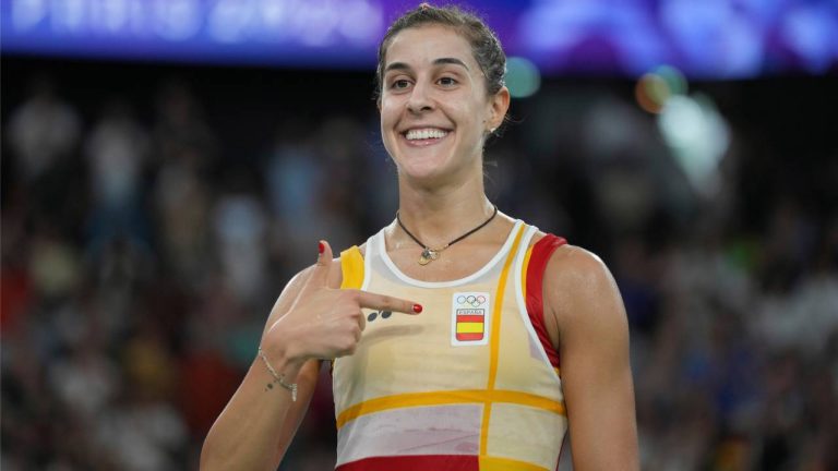 Spain's Carolina Marin celebrates after defeating Japan's Aya Ohori during their women's singles badminton quarterfinal match at the 2024 Summer Olympics, Aug. 3, 2024, in Paris, France. (Kin Cheung/AP)
