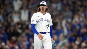 Toronto Blue Jays pitcher Kevin Gausman (34) reacts after throwing a strikeout against the Athletics during first inning MLB baseball action in Toronto on Friday, March 27, 2026. (Nathan Denette/CP)