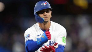 Toronto Blue Jays Andrés Giménez (0) reacts after hitting a triple against the Athletics during fifth inning MLB baseball action in Toronto on Friday, March 27, 2026. (Nathan Denette/CP)