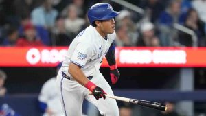 Toronto Blue Jays third baseman Kazuma Okamoto hits into a ground out double play against Athletics during fifth inning American League baseball action in Toronto on Sunday, March 29, 2026. (Nathan Denette/CP)