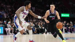 Miami Heat guard Tyler Herro (14) dribbles as Philadelphia 76ers guard Kelly Oubre Jr. (9) defends during the second half of an NBA basketball game, Monday, March 30, 2026, in Miami. (Lynne Sladky/AP)