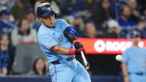 Toronto Blue Jays' Kazuma Okamoto (7) flies out against the Colorado Rockies during fourth inning MLB baseball action in Toronto on Tuesday, March 31, 2026. (Nathan Denette/CP)