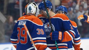 Edmonton Oilers goalie Connor Ingram (39) and Evan Bouchard (2) celebrate the win over the Seattle Kraken during NHL action, in Edmonton on Tuesday March 31, 2026. (Jason Franson/CP)