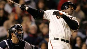 San Francisco Giants' Barry Bonds, right, swings on a solo home run off of Scott Proctor in the eighth inning of a baseball game in San Francisco, Friday, June 22, 2007. It was Bonds' 749th career home run. At left is New York Yankees' Jorge Posada. (Jeff Chiu/AP)