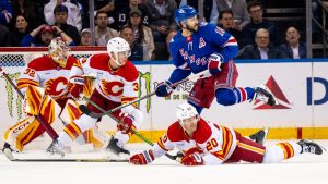 Calgary Flames left wing Blake Coleman (20) falls near the goal during the first period of an NHL hockey game against the New York Rangers, Tuesday, March 10, 2026, in New York. (Angelina Katsanis/AP)