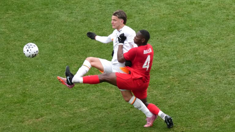 Canada's Kamal Miller clears the ball from Iceland's Brynjofur Willumsson Willumsson during second half International friendly soccer action, in Toronto, on Saturday March 28, 2026. (Chris Young/CP)