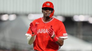 Canada's Denzel Clarke celebrates after scoring against Puerto Rico during the third inning of a World Baseball Classic game in San Juan, Puerto Rico, Tuesday, March 10, 2026. (Fernando Llano/AP)