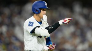 Los Angeles Dodgers designated hitter Shohei Ohtani (17) walks to first base after being hit by a pitch during the seventh inning of an opening-day baseball game against the Arizona Diamondbacks Thursday, March 26, 2026, in Los Angeles. (Mark J. Terrill/AP)