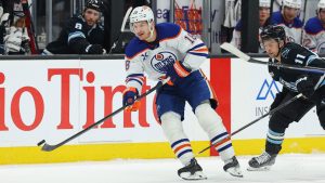 Edmonton Oilers left wing Zach Hyman (18) passes the puck against the Utah Mammoth during the first period of an NHL hockey game, Tuesday, March 24, 2026, in Salt Lake City. (Melissa Majchrzak/AP)