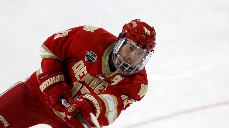 Denver forward Massimo Rizzo (13) shoots before the start of an NCAA hockey game against Boston College on Saturday, Oct. 21, 2023, in Chestnut Hill, Mass. (Greg M. Cooper/AP)