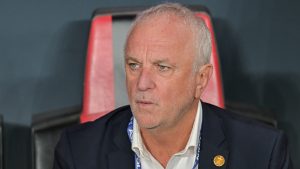 Iraq's head coach Graham Arnold sits on the bench at the start of the 2026 World Cup play off first leg soccer match between UAE and Iraq in Abu Dhabi, United Arab Emirates, Friday, Nov. 14, 2025. (Walid Ibrahim/AP)