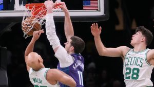 Charlotte Hornets centre Ryan Kalkbrenner (11) dunks against Boston Celtics guard Jordan Walsh (27) during the second half of an NBA basketball game, Wednesday, March 4, 2026, in Boston. (Charles Krupa/AP)