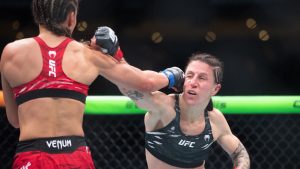 Jamey-Lyn Horth, right ,takes a punch from Ivana Petrovic during the women's flyweight bout at UFC Fight Night in Edmonton on Saturday, Nov. 2, 2024. Canadian flyweight Horth waited 11 months for her last UFC fight. (THE CANADIAN PRESS/Jason Franson)