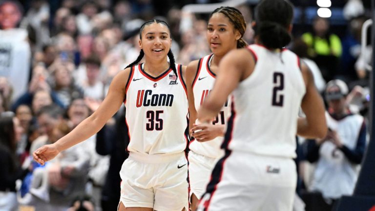 UConn guard Azzi Fudd (35) with UConn forward Sarah Strong (21) and UConn guard KK Arnold (2) in the second half of an NCAA college basketball game against Tennessee, Sunday, Feb. 1, 2026, in Hartford, Conn. (Jessica Hill/AP)