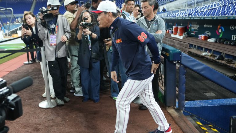 Japan's manager Hirokazu Ibata walks from the dugout before a World Baseball Classic quarterfinal game against Venezuela, Saturday, March 14, 2026, in Miami. (Lynne Sladky/AP)