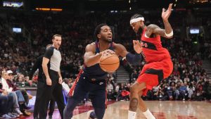 Cleveland Cavaliers guard Donovan Mitchell (45) drives at Toronto Raptors forward Brandon Ingram (3) during first half NBA basketball action in Toronto on Monday November 24, 2025. (Chris Young/CP)