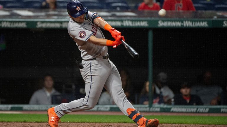 Houston Astros' Grae Kessinger hits a fly out off Cleveland Guardians relief pitcher Cade Smith during the seventh inning of a baseball game in Cleveland, Saturday, Sept. 28, 2024. (AP Photo/Phil Long)