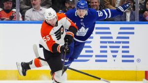 Toronto Maple Leafs Easton Cowan (53) catches a tripping penalty for tripping up Philadelphia Flyers Rasmus Ristolainen (55) during first period NHL hockey action in Toronto, Monday, March 2, 2026. (Frank Gunn/CP)