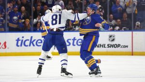 Toronto Maple Leafs centre Dakota Joshua (81) and Buffalo Sabres defenseman Luke Schenn (5) fight during the first period of an NHL hockey game Saturday, March 14, 2026, in Buffalo, N.Y. (Jeffrey T. Barnes/AP)