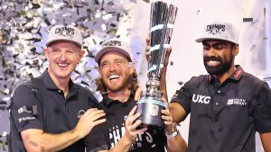 From left, Justin Rose, Tommy Fleetwood and Sahith Theegala celebrate with the TGL champions trophy after winning the golf tournament Tuesday, March 24, 2026, in Palm Beach Gardens, Fla. (Reinhold Matay/AP)