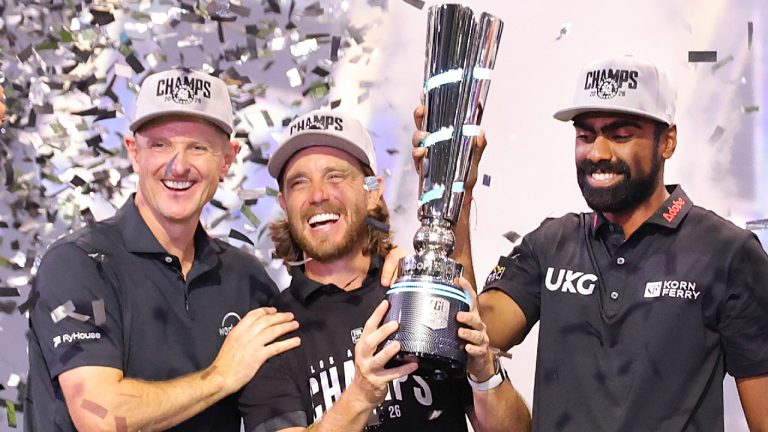 From left, Justin Rose, Tommy Fleetwood and Sahith Theegala celebrate with the TGL champions trophy after winning the golf tournament Tuesday, March 24, 2026, in Palm Beach Gardens, Fla. (Reinhold Matay/AP)