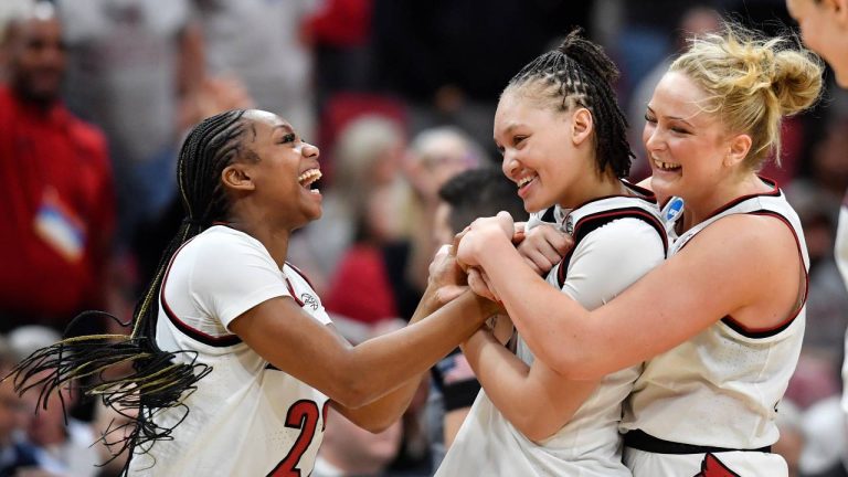 Louisville forward Laura Ziegler, right, and guard Tajianna Roberts (22) celebrate with guard Imari Berry, center, after Berry made two free throws to put Louisville ahead during the second half in the second round of the NCAA college basketball tournament against Alabama, Monday, March 23, 2026, in Louisville, Ky. (Timothy D. Easley/AP)