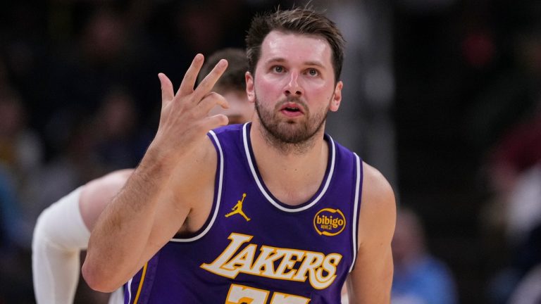 Los Angeles Lakers guard Luka Doncic (77) gestures after a three-point basket against the Indiana Pacers during the first half of an NBA basketball game in Indianapolis, Wednesday, March 25, 2026. (Michael Conroy/AP)