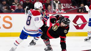 Montreal Canadiens' Lane Hutson (48) collides with Ottawa Senators' Michael Amadio (22) during second period NHL hockey action in Ottawa, on Wednesday, March 11, 2026. (Spencer Colby/CP)