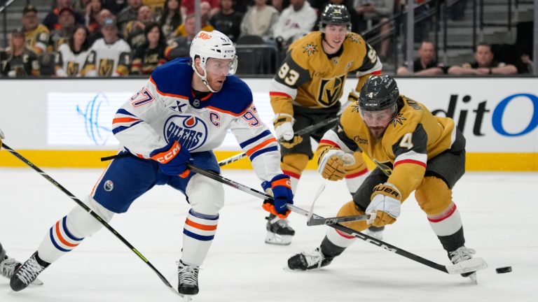 Edmonton Oilers centre Connor McDavid (97) shots against Vegas Golden Knights defenceman Rasmus Andersson (4) during the first period of an NHL hockey game Sunday, March 8, 2026, in Las Vegas. (John Locher/AP)