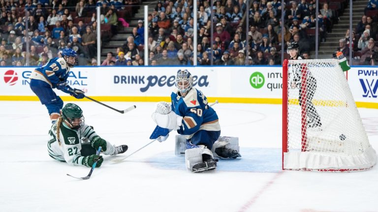 Boston Fleet's Shay Maloney (27) scores on Vancouver Goldeneyes goaltender Kristen Campbell (50) as Sarah Nurse (20) watches during PWHL overtime action in Vancouver, on Tuesday, March 10, 2026. (Ethan Cairns/CP)