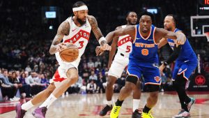 Toronto Raptors' Brandon Ingram (3) drives past New York Knicks' Og Anunoby (8) during first half NBA basketball action in Toronto on Tuesday, March 3, 2026. (Nathan Denette/CP)