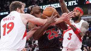 Chicago Bulls centre Jalen Smith, centre, battles for a ball against Toronto Raptors centre Jakob Poeltl, left, and forward Brandon Ingram during the first half of an NBA basketball game in Chicago, Wednesday, March 18, 2026. (Nam Y. Huh/AP)