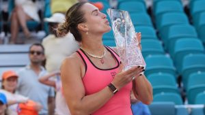 Aryna Sabalenka kisses the trophy after winning the women's singles final at the Miami Open tennis tournament, Saturday, March 28, 2026, in Miami Gardens, Fla. (AP Photo/Marta Lavandier)