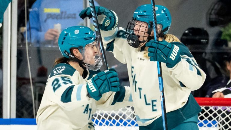 Seattle Torrent's Julia Gosling, left, celebrates a goal with Alex Carpenter (25). (Ethan Cairns/CP)