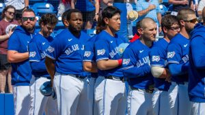 The Toronto Blue Jays line up for the anthems prior to the first Spring Training game against the Philadelphia Phillies in Dunedin, Fla. on Saturday February 21, 2026. (Frank Gunn/CP)