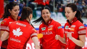 Team Canada, left to right, second Shannon Birchard, lead Karlee Burgess, skip Kerri Einarson and third Val Sweeting celebrate scoring three in the first end against Japan in the semifinal at the World Women's Curling Championship in Calgary, Saturday, March 21, 2026. (Jeff McIntosh/CP)