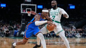 Oklahoma City Thunder guard Shai Gilgeous-Alexander, left, drives to the basket against Boston Celtics guard Jaylen Brown (7) during the first half of an NBA basketball game, Wednesday, March 25, 2026, in Boston. (Charles Krupa/AP)