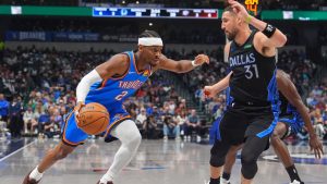 Oklahoma City Thunder guard Shai Gilgeous-Alexander (2) drives against Dallas Mavericks guard Klay Thompson (31) during the first half of an NBA basketball game in Dallas, Sunday, March 1, 2026. (AP Photo/LM Otero)
