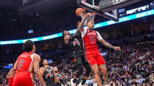 Toronto Raptors RJ Barrett (9) scores on New Orleans Pelicans Jordan Hawkins (24) during first half NBA basketball action in Toronto on Friday March 27 2026. (Chris Young/CP)
