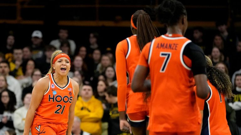 Virginia guard Kymora Johnson (21) celebrates after making a three-point basket during the first half against Iowa in the second round of the NCAA college basketball tournament, Monday, March 23, 2026, in Iowa City, Iowa. (AP Photo/Charlie Neibergall)