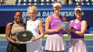 Taylor Townsend, of the United States, left, and Katerina Siniakova, of the Czech Republic, pose for a photo with Erin Routliffe, of New Zealand, left, and Gabriela Dabrowski, of Canada, Routliffe and Dabrowski won the women's doubles final of the U.S. Open tennis championships, Friday, Sept. 5, 2025, in New York.of the U.S. Open tennis championships, Friday, Sept. 5, 2025, in New York. (AP Photo/Frank Franklin II)