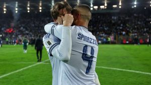 Italy's Marco Palestra and Leonardo Spinazzola console each other after losing a penalty shootout during the World Cup qualifying playoff final soccer match between Bosnia and Italy in Zenica, Bosnia, Tuesday, March 31, 2026. (AP Photo/Armin Durgut)