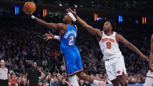 Oklahoma City Thunder's Shai Gilgeous-Alexander (2) drives past New York Knicks' Og Anunoby (8) during the first half of an NBA basketball game Wednesday, March 4, 2026, in New York. (AP Photo/Frank Franklin II)