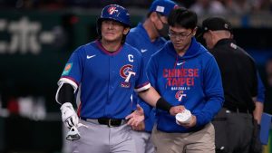 Taiwan's Chen Chieh-hsien reacts after getting hit by a pitch by Australia's pitcher Jack O'Loughlin in the sixth inning of a World Baseball Classic game in Tokyo, Thursday, March 5, 2026. (AP Photo/Louise Delmotte)