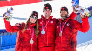 Kurt Oatway, Kalle Eriksson, Sierra Smith pose with their Medals at the 2026 Paralympic Games in Cortina, Italy on March 7, 2026 