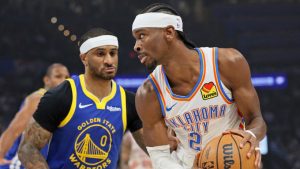 Oklahoma City Thunder guard Shai Gilgeous-Alexander (2) looks for an outlet against Golden State Warriors guard Gary Payton II (0) during the first half of an NBA basketball game Saturday, March 7, 2026, in Oklahoma City. (AP Photo/Nate Billings)