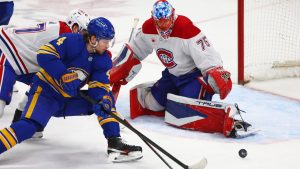 Montréal Canadiens goaltender Jakub Dobes stops Buffalo Sabres defenceman Bowen Byram during the third period of an NHL game Saturday, Jan. 31, 2026, in Buffalo, N.Y. (AP Photo/Jeffrey T. Barnes)