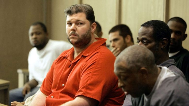 Former Oakland Raiders centre Barret Robbins, left, sits with fellow prisoners as he awaits his hearing at the Miami-Dade courthouse Friday, Sept. 23, 2005, in Miami. (AP Photo/J. Pat Carter)