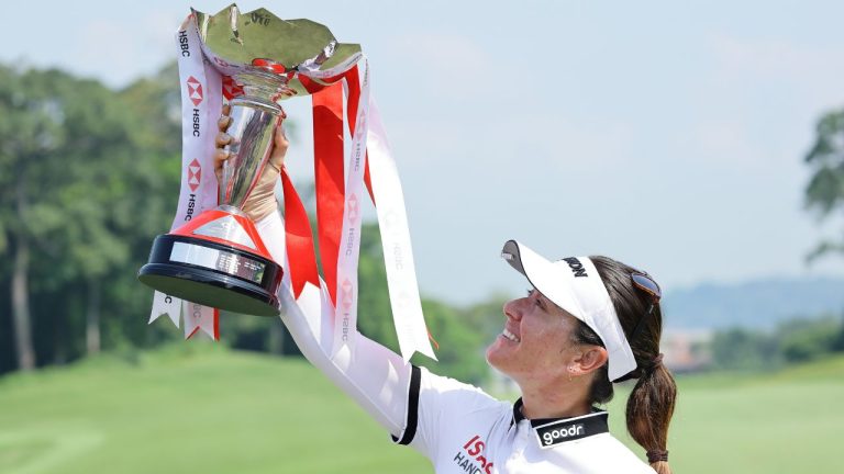 Hannah Green of Australia poses with the tournament trophy after winning the HSBC Women's World Championship at Sentosa Golf Club in Singapore, Sunday, March 1, 2026. (AP Photo/Suhaimi Abdullah)